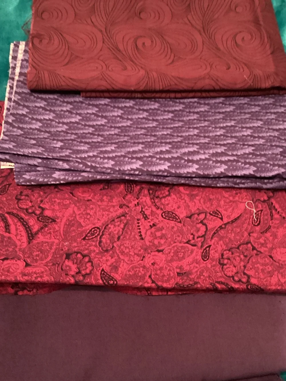 Assorted purple fabrics